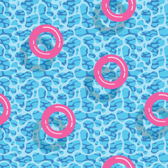 pink inflatable circles in blue water pattern