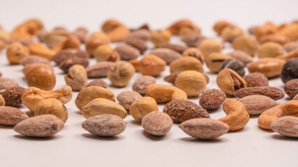  A group of almonds, pistachios, walnuts, macadamia, cashews.