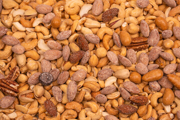 A group of almonds, pistachios, walnuts, macadamia, cashews.