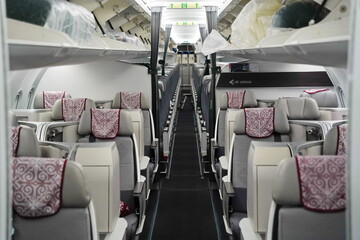 Fototapeta premium Astana, Kazakhstan - 10.17.2022 : Assembly and repair of the passenger cabin of the Airbus A320 Air Astana airline