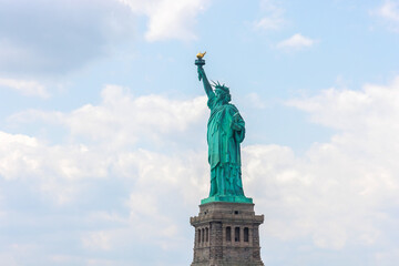 Fototapeta premium Located in middle of New York City, the Statue of Liberty is in front of you.