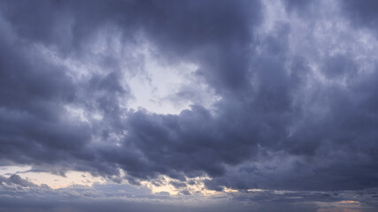Moody wild sky panorama cloudscape background during sunset