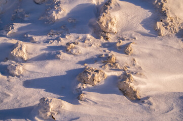 Fototapeta premium A snow pile of snow removed from the road-