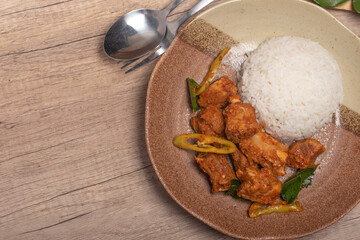 Stir-fried pork ribs with curry paste and steamed rice