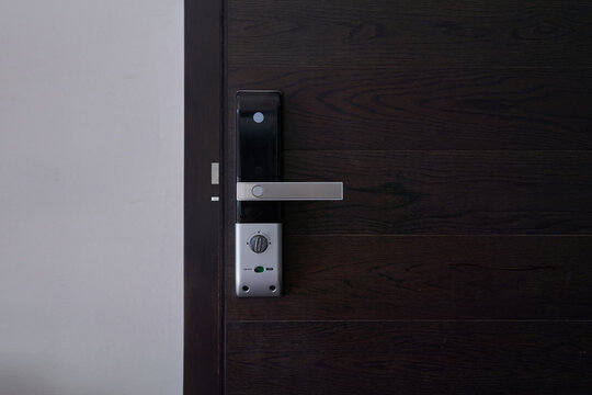 Digital Door Lock On Black Wooden Door Panel., Door With A Keyhole