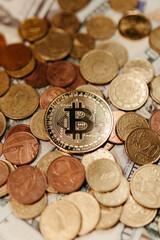 golden bitcoin coin with dollar and euro background