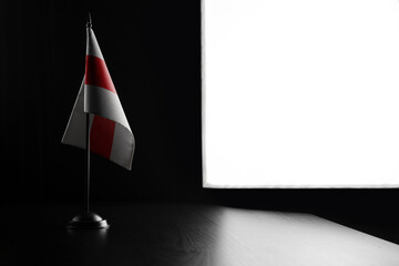 Small national flag of the Belarus on a black background