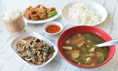 Northeastern Thai  cuisine, Roasted pork liver spicy salad, Deep fried chicken tendons with sweet sauce, Thai spicy soup with herbs and sticky rice