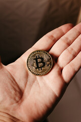 Fototapeta na wymiar hands holding golden cryptocurrencies