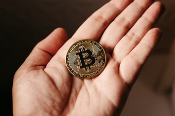 Fototapeta na wymiar hands holding golden cryptocurrencies