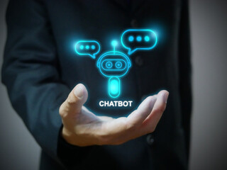 A hand holding digital chatbot that conducting an online chat conversation and provide information. Chatterbot application, AI, Artificial intelligence, global connection, innovation and technology