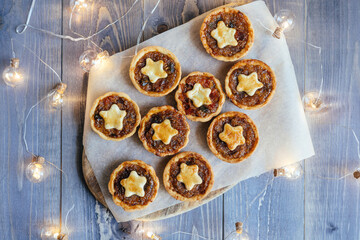 Christmas mince pies with fruit filling on a gray background.