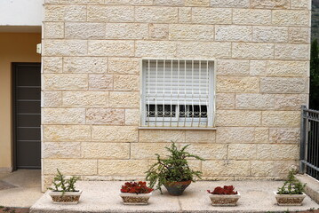 Fototapeta na wymiar A small window in a residential building in a big city