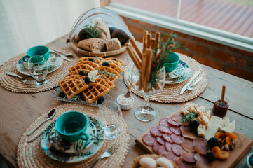 Fototapeta na wymiar table set with food plates and cutlery
