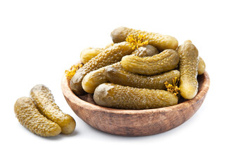 Marinated cucumbers in wooden bowl on white backgrounds. © margo555