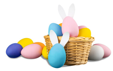 Basket with colorful eggs isolated on white background