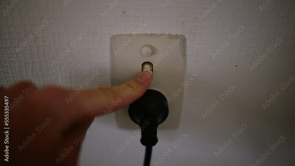 Poster plugging in black plug then switching on power point