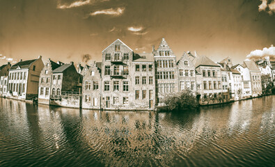 View of Graslei quay and Leie river in the historic city center in Gent, Belgium. Architecture and...