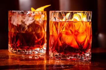 Negroni cocktail with orange peel and ice