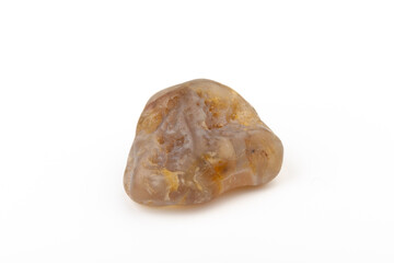 Multicolored gemstones, tumbled minerals. Bostwan agate of various sizes on a white background.