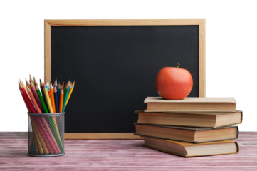 Stack of books with chalk blackboard and colored pencils on the wooden table.