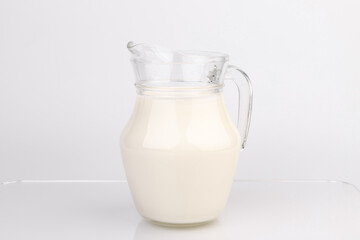 Jug of milk isolated on white background with clipping path.