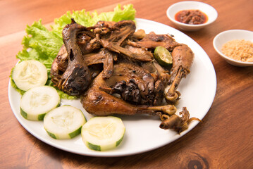 Sweet soy sauce grilled whole chicken, is a popular dish in Java and Indonesia. Made with free-range chicken or Ayam Kampong that is marinated and eaten with fresh vegetables and chili sauce