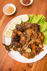 Sweet soy sauce grilled whole chicken, is a popular dish in Java and Indonesia. Made with free-range chicken or Ayam Kampong that is marinated and eaten with fresh vegetables and chili sauce