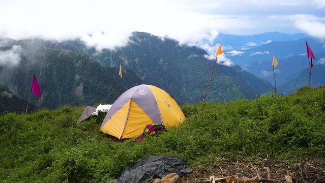 July 14th 2022, Himachal Pradesh India. Tents and camps with beautiful landscapes, valley and mountains in the background. Shrikhand Mahadev Kailash Yatra in the Himalayas.