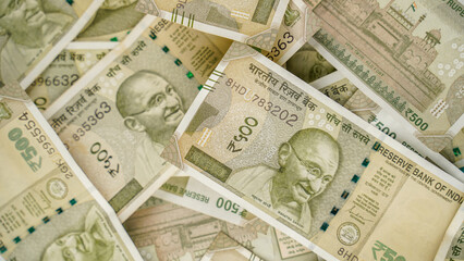 Indian Rupees background, Pile of Indian money cash. Five hundred rupee currency banknotes.