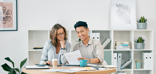 Fototapeta premium Senior, woman and worker with business documents or sales growth analytics for data analysis at office desk. Paperwork, leadership or company manager training or helping worker with marketing advice