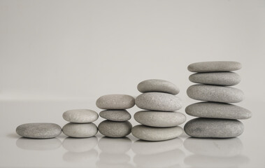 stack of Round stones in the form of stairs. isolated on a white background