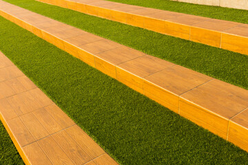 Synthetic grass which is installed alternately with ceramics, is used for seating or relaxing in an...