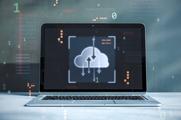 Close up of workplace desktop with laptop computer and digital cloud computing hologram on blurry background. Cloud data, server, service and hosting concept. Double exposure.