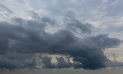 Fototapeta premium Murky summer sky covered with grey clouds. Nature in waiting for rain