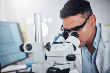 Science, microscope and man in laboratory for research, testing or medical analysis. Healthcare innovation, scientist and male doctor with equipment to check sample, studying particles or bacteria.