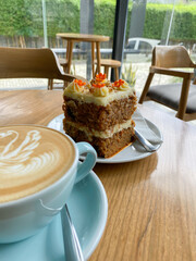 close up Delicious carrot cake for snack with coffee on wooden table
