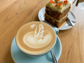 close up Delicious carrot cake for snack with coffee on wooden table