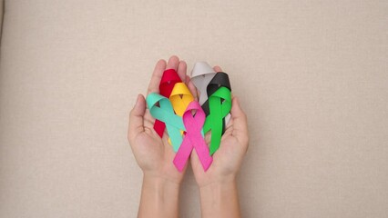 World cancer day, February 4. Colorful ribbons for supporting people living and illness. Healthcare, fighting, medical and National Cancer Survival day, Autism awareness day concept - Powered by Adobe