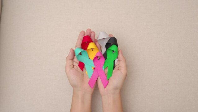World cancer day, February 4. Colorful ribbons for supporting people living and illness. Healthcare, fighting, medical and National Cancer Survival day, Autism awareness day concept