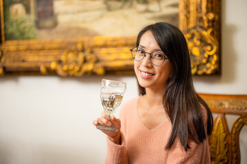 Woman drink of glass of water at restaurant