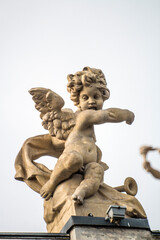 Figurines in the form of babies - cupids - putti on the roof of the Opera House in Odessa, Ukraine