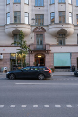 A taxi in front of old hotel building facade in Stockholm, Sweden