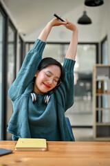 Portrait, Charming and relaxed young Asian female college student stretching hands