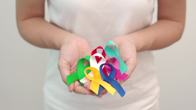 World cancer day, February 4. Colorful ribbons for supporting people living and illness. Healthcare, fighting, medical and National Cancer Survival day, Autism awareness day concept