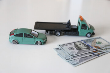 Tow truck with a stack of money. Call a tow truck for a broken car. High price