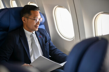 Successful Asian businessman or male CEO traveling for an overseas business meeting.