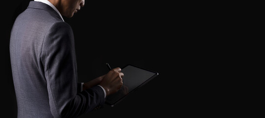 Businessman working with modern digital tablet. Concepts of working anywhere, compliance, policies, data encryption