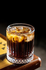 tasty cocktail on the wooden background