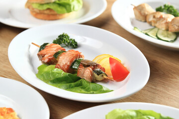 kebab, Burger and salads on the table